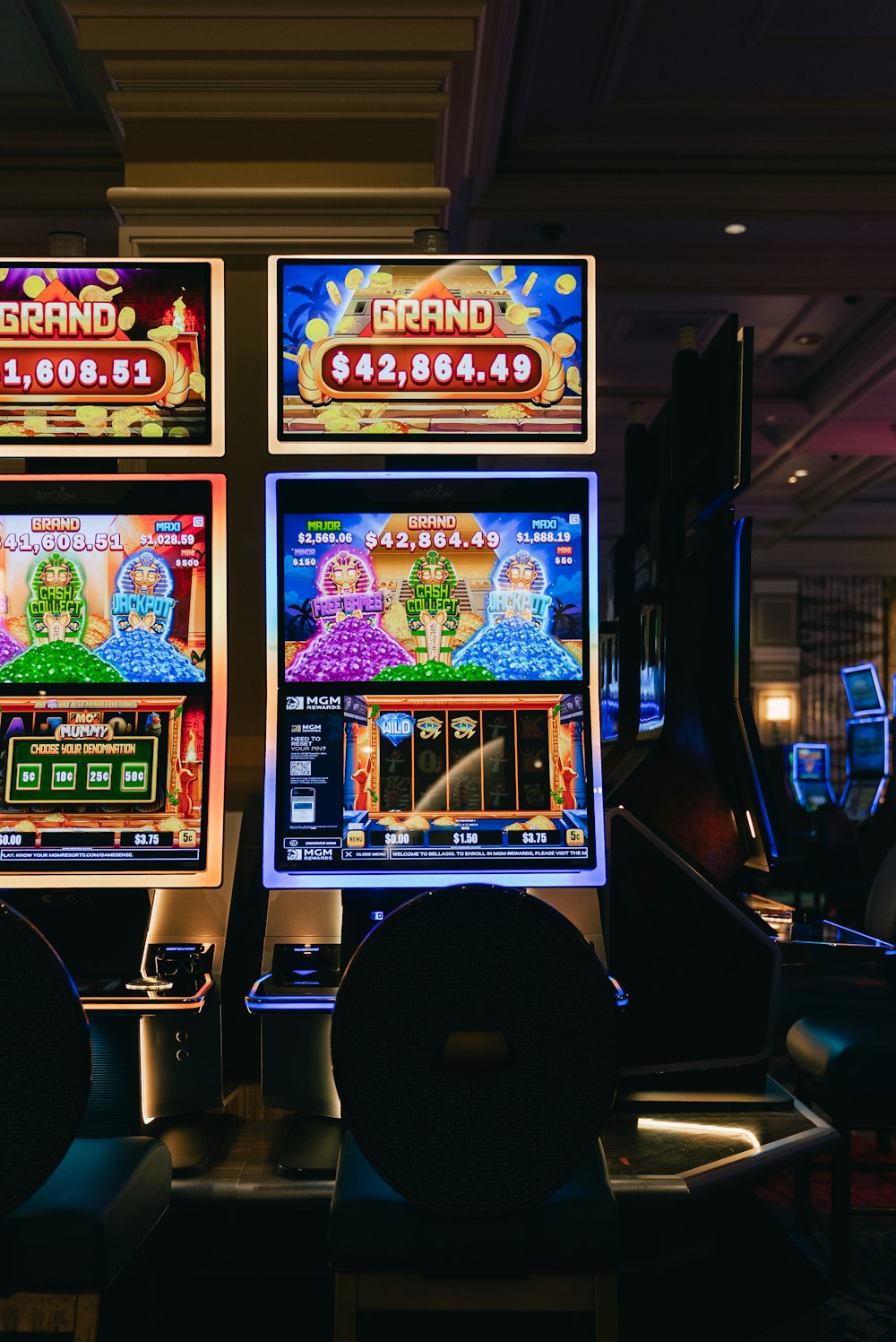 Colorful slot machines on a casino floor.